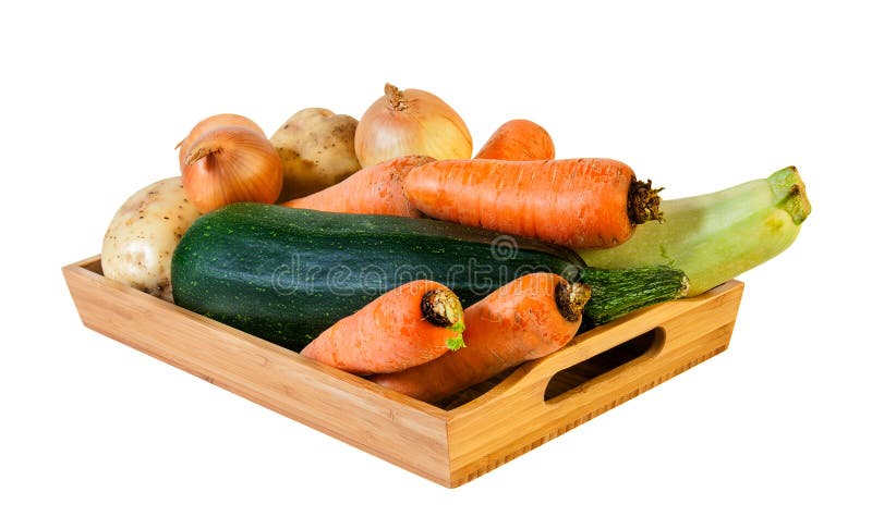 Fresh vegetables on wooden tray isolated on white