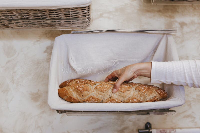 Fresh and warm. close up woman hand holding fresh and warm bread just from the oven. Bakery concept stock photos Fresh and warm. close up woman hand holding fresh and warm bread just from the oven. Bakery concept stock photos