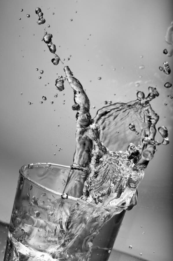 Fresh Water Splashing Out of a Glass with Ice Stock Photo Image of pure, smooth 18207656