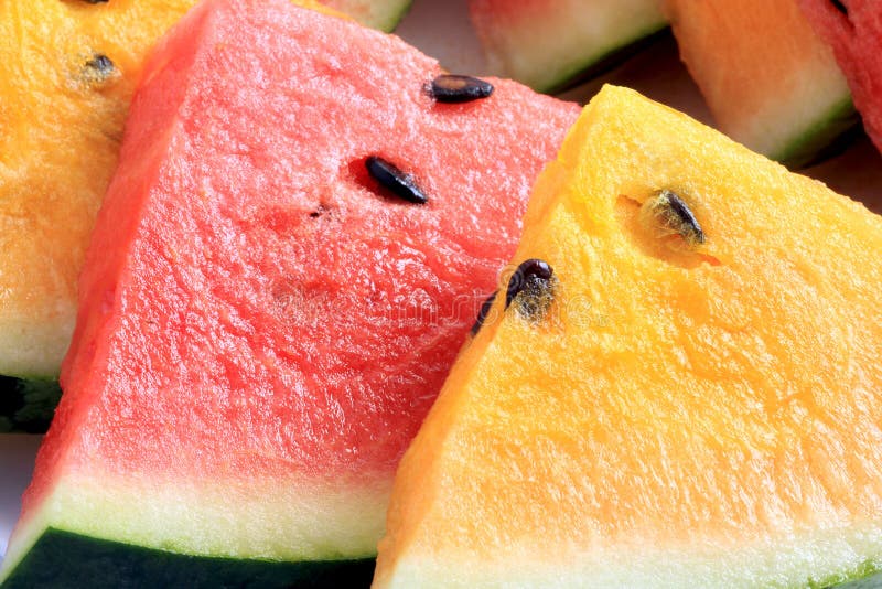 Close-up of sliced fresh red and yellow watermelon fruit. Close-up of sliced fresh red and yellow watermelon fruit.