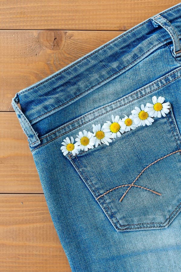 Flowers on jeans stock image. Image of handmade, cotton - 32274817