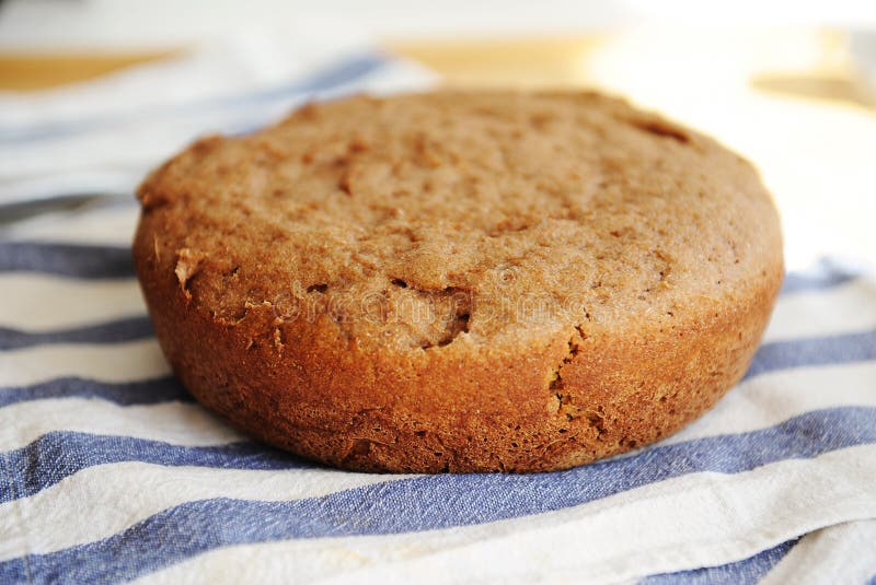 Freshly baked homemade whole grain bread. Round loaf. Freshly baked homemade rye-wheat whole grain bread. Round loaf royalty free stock images Freshly baked homemade whole grain bread. Round loaf. Freshly baked homemade rye-wheat whole grain bread. Round loaf royalty free stock images