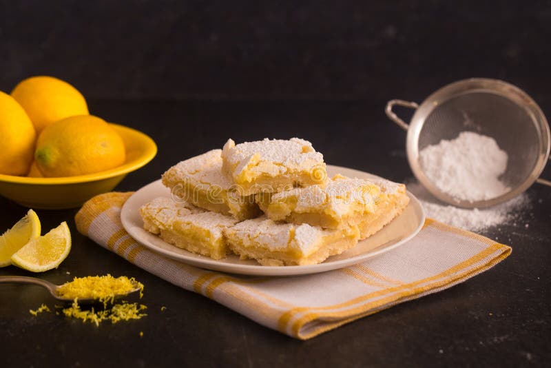 Freshly Baked Lemon Bars on a Dark Background