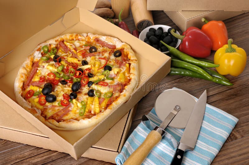 Freshly Baked Pizza in Delivery Box with Ingredients. Stock Photo