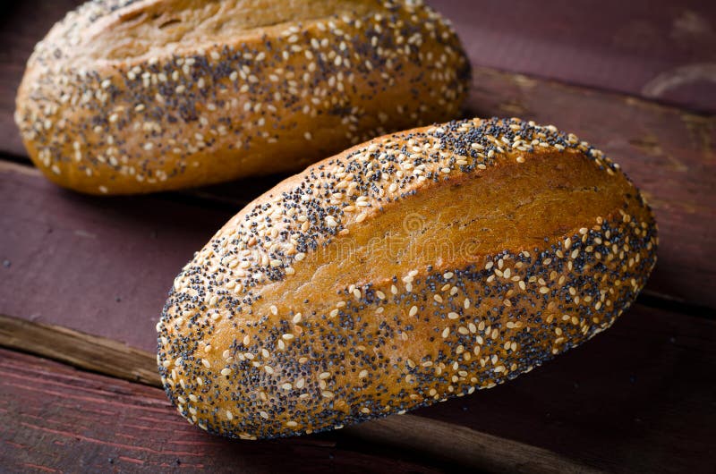 Freshly Baked Small Breads with Sesame and Poppy Seeds Stock Photo