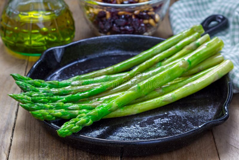 Freshly cooked asparagus appetizer on a cast iron skillet