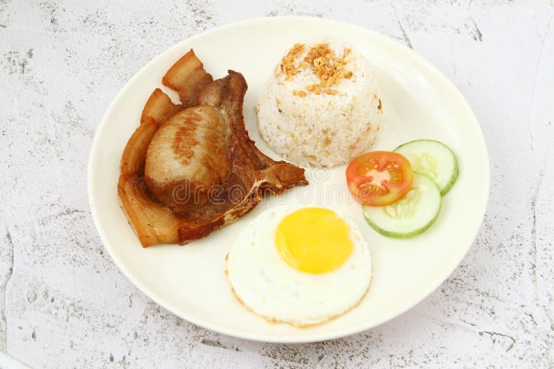Freshly Cooked Filipino Food Called Pork Chop Silog or Pork Chop, Egg