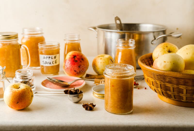 Freshly Cooked Homemade Applesauce in Glass Jars, Ingredients, Plate