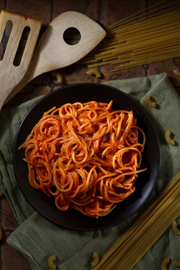 Freshly Cooked Spaghetti Pasta with Tomato Sauce on a Plate Stock Photo