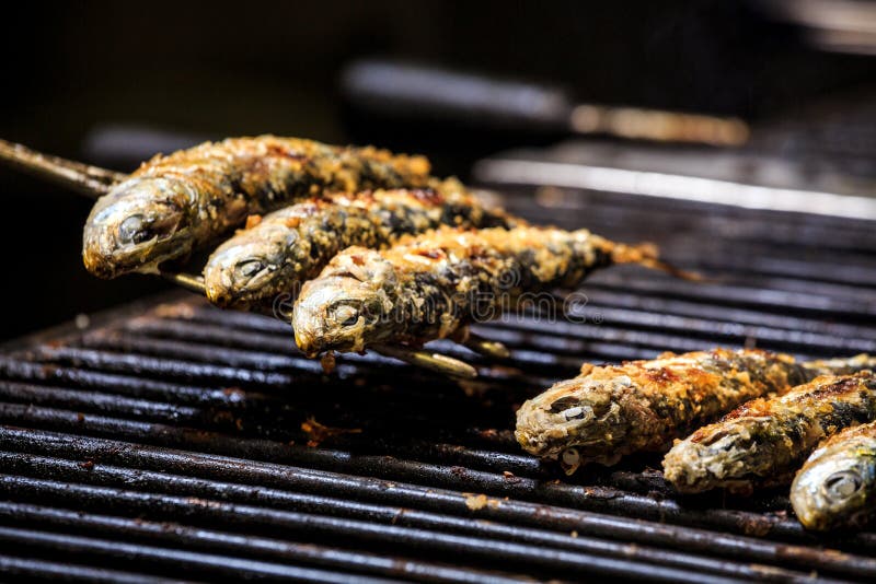 Freshly Grilled Sardines on Silver Plate Stock Photo Image of hand