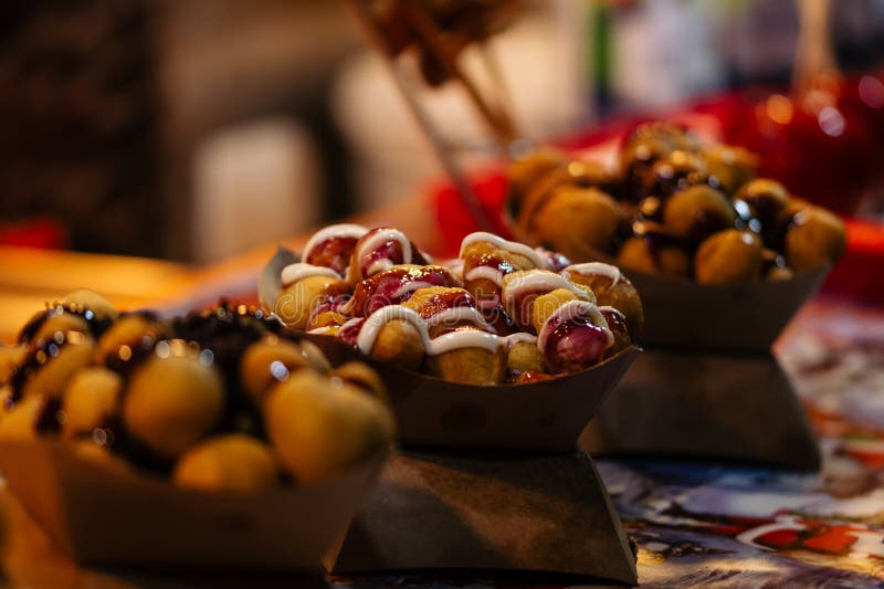 Freshly made donuts at Christmas market royalty free stock photography