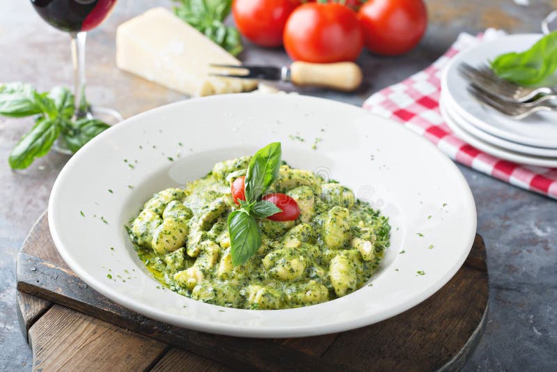 Freshly made gnocchi with pesto sauce royalty free stock photo