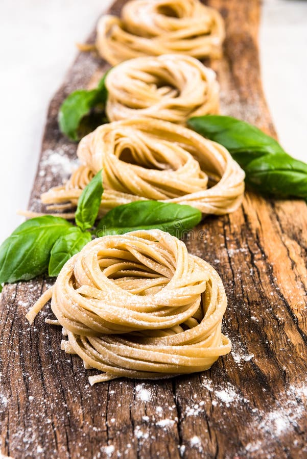 Freshly made italian pasta on wooden board