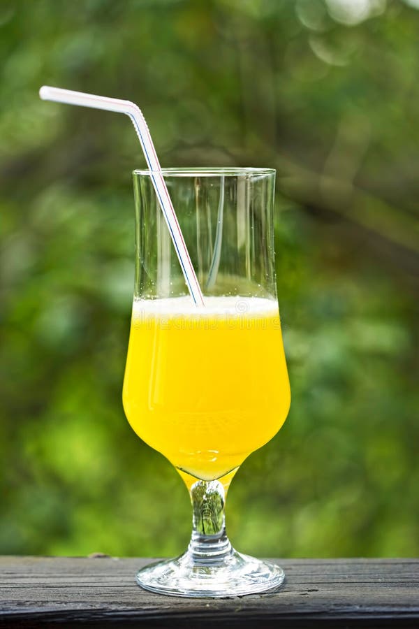Freshly Made Pineapple Juice in Tall Glass with Straw Outdoors Stock ...