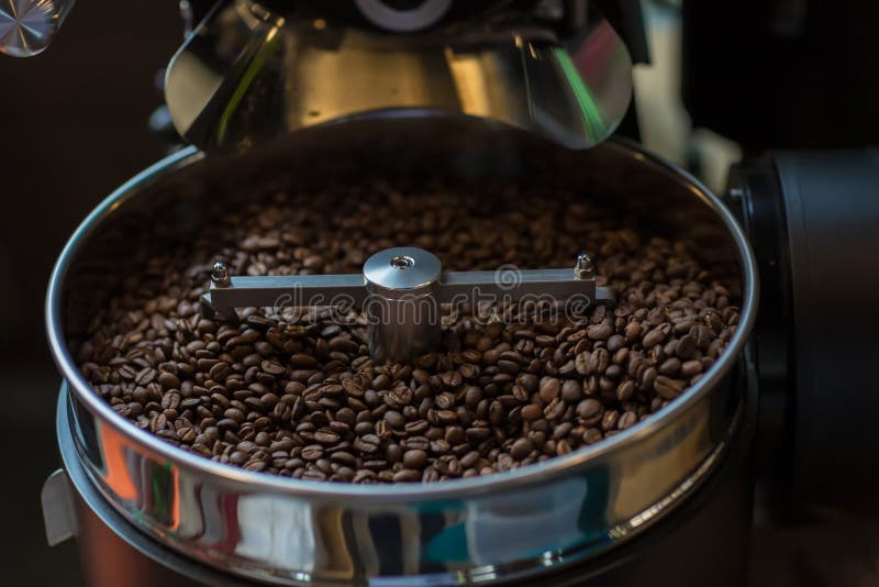 Freshly roasted aromatic coffee beans in a modern coffee roasting machine. Fresh Coffee Beans - Freshly roasted spinning cooler pr royalty free stock photos Freshly roasted aromatic coffee beans in a modern coffee roasting machine. Fresh Coffee Beans - Freshly roasted spinning cooler pr royalty free stock photos