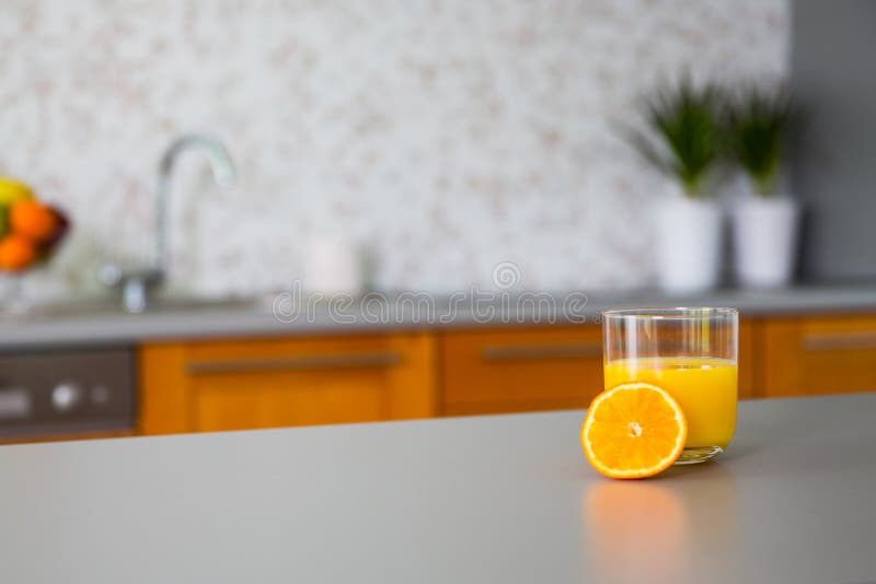 Freshly squeezed orange juice in modern kitchen. Freshly squeezed orange juice in modern kitchen