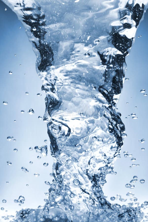 Close up photograph of fresh blue water splash and drodlets. Whirlpool vortex water stock images, royalty-free photos and pictures