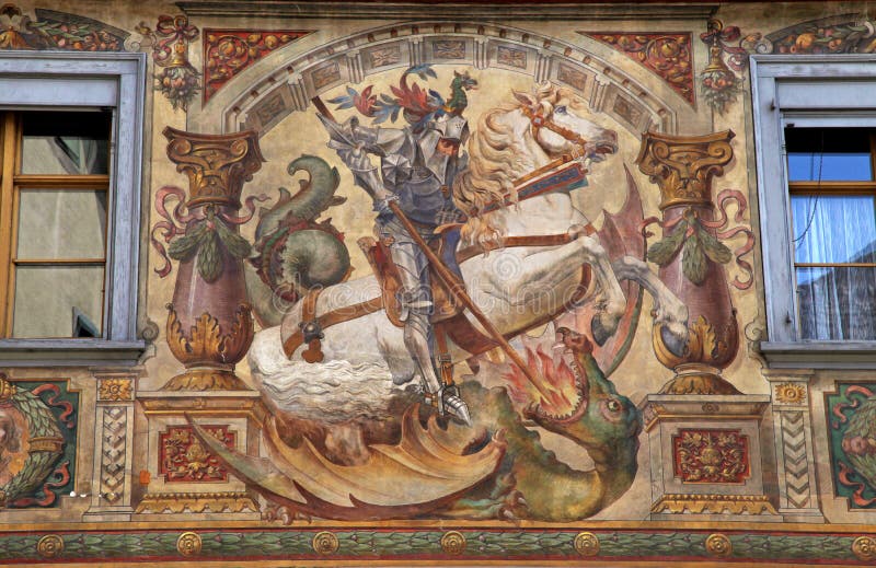 Old beautiful fresco with St. George and dragon on medieval building in Stein am Rhein, Switzerland. Old beautiful fresco with St. George and dragon on medieval building in Stein am Rhein, Switzerland