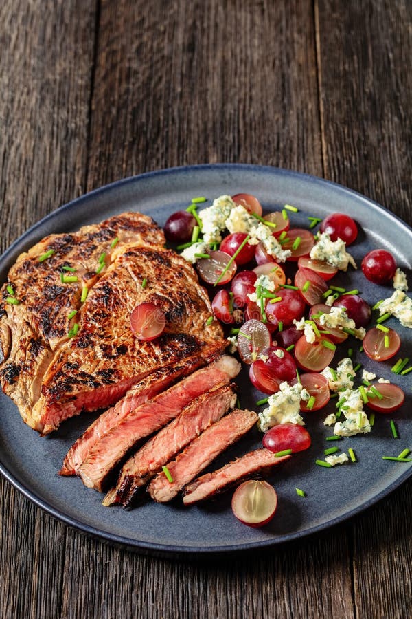 Fried Beef Steak with Salad of Grape, Cheese Stock Image - Image of