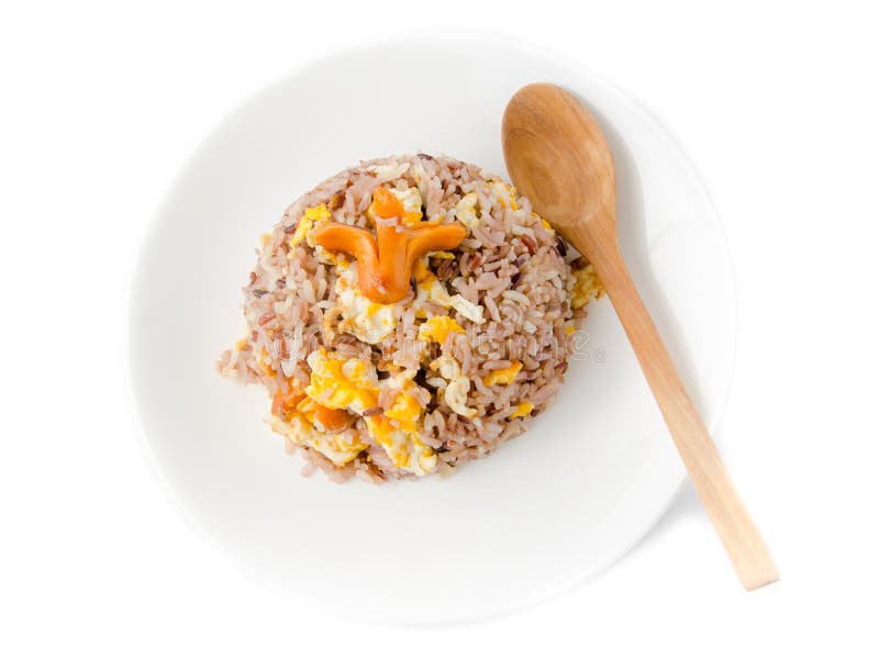 Fried Brown Rice with Eggs and Sausages on White Dish.. Stock Photo