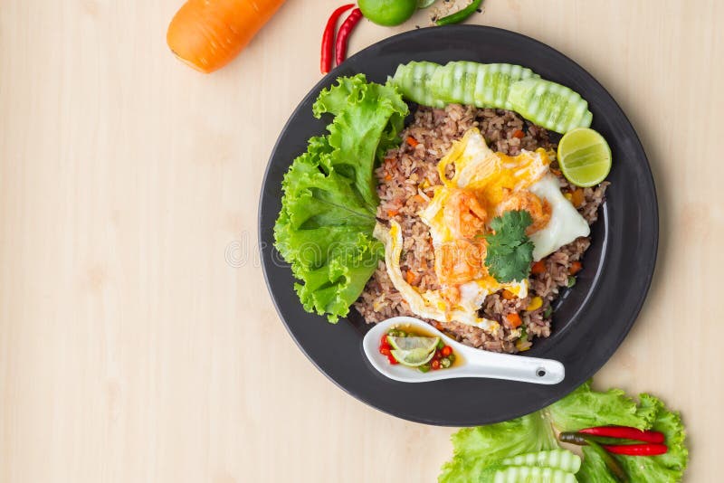 Fried Brown Rice with Shrimp and Fried Egg in Thai. Prepared and Served