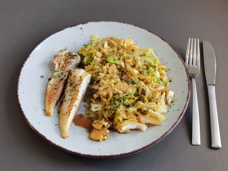 Fried cabbage with fish stock photo. Image of meal, plant 224478470