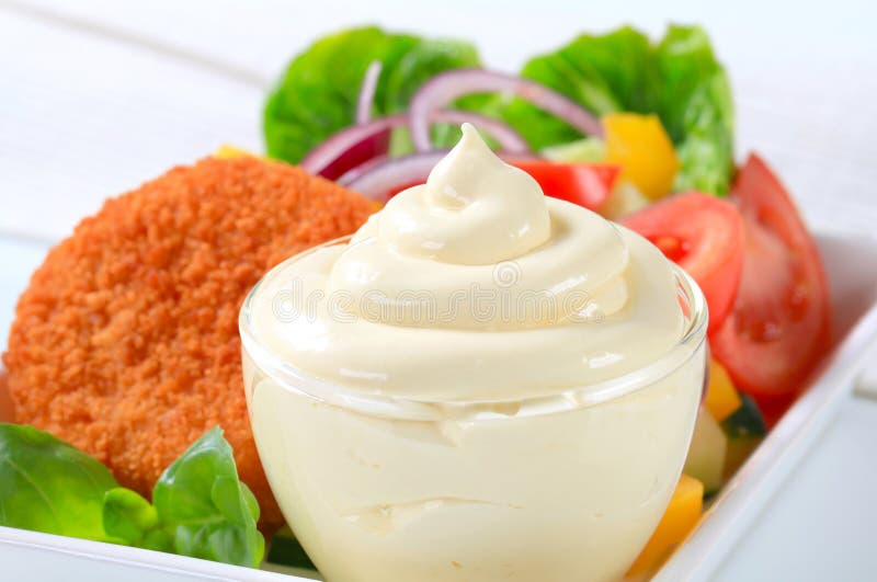 Fried cheese with vegetable salad and mayonnaise