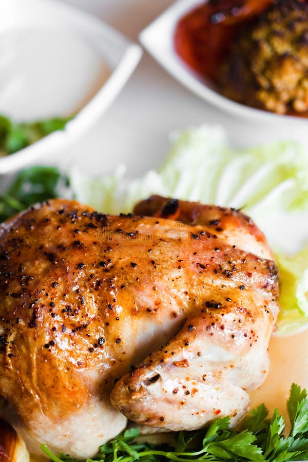 Fried chicken with vegetables on a plate closeup