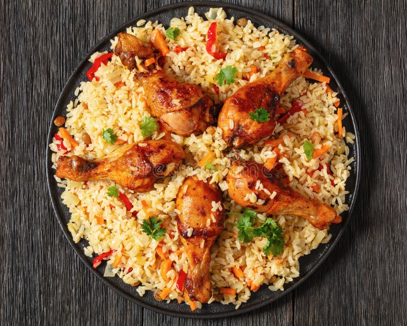 Fried Chicken Drumsticks Over Rice Pilaf, Top View Stock Photo - Image ...