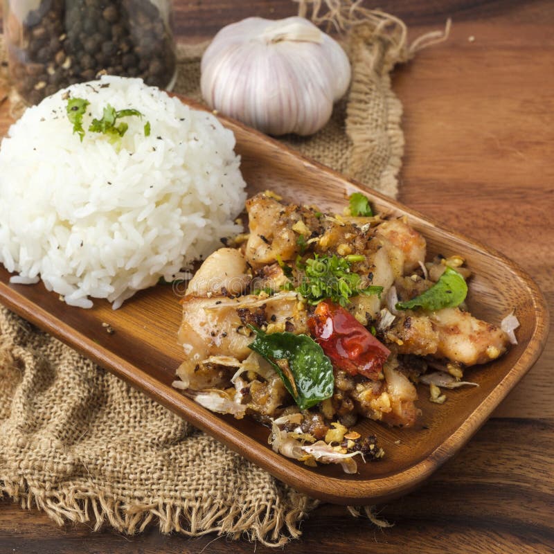 Fried Chicken with Garlic and Pepper with Rice. Thai Dish Stock Photo