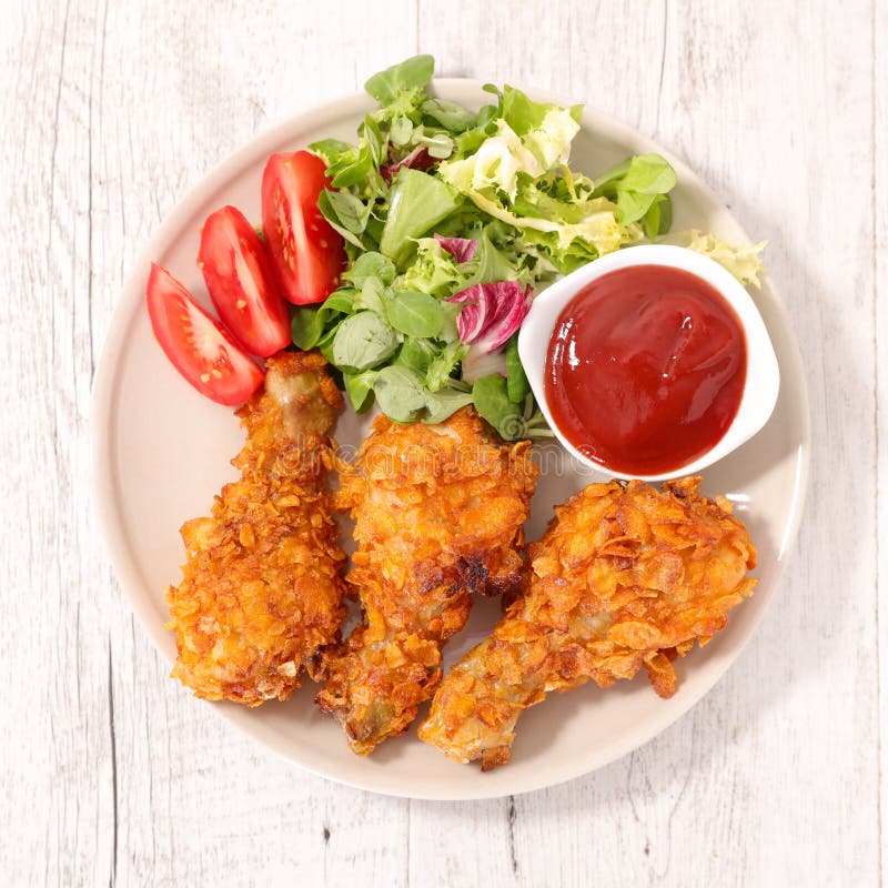 Fried chicken with ketchup stock image. Image of crunchy 79893737