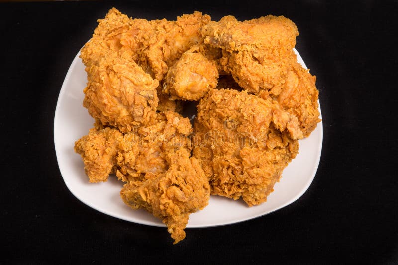 Fresh, crispy, fried chicken on a white plate. Fresh, crispy, fried chicken on a white plate