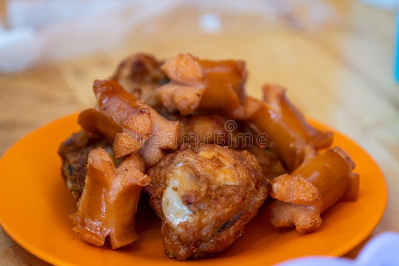Fried chicken wings and hotdog on orange plate. chicken tasty dinner. The Fried chicken wings and hotdog on orange plate. chicken tasty dinner royalty free stock photos Fried chicken wings and hotdog on orange plate. chicken tasty dinner. The Fried chicken wings and hotdog on orange plate. chicken tasty dinner royalty free stock photos