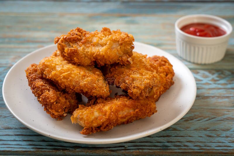 Fried chicken wings with ketchup royalty free stock photo