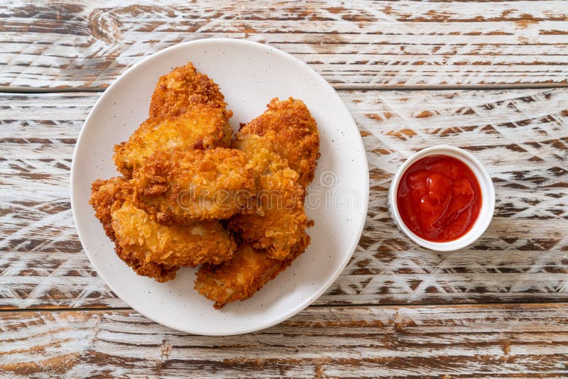 Fried chicken wings with ketchup royalty free stock photo