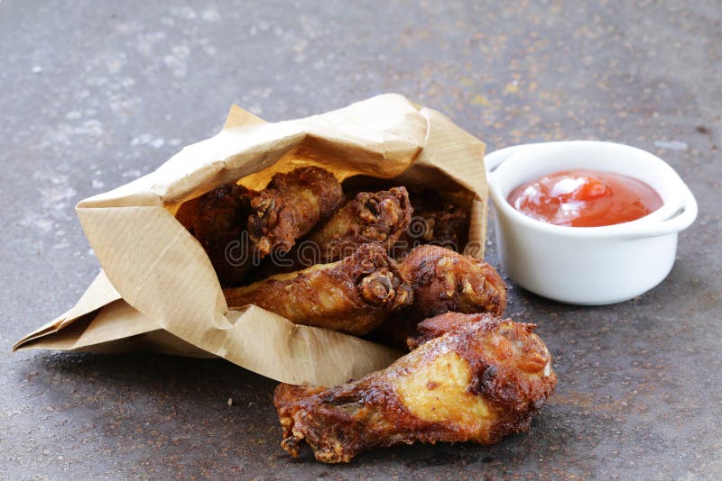 Fried chicken wings with sauce. Snack, spicy.