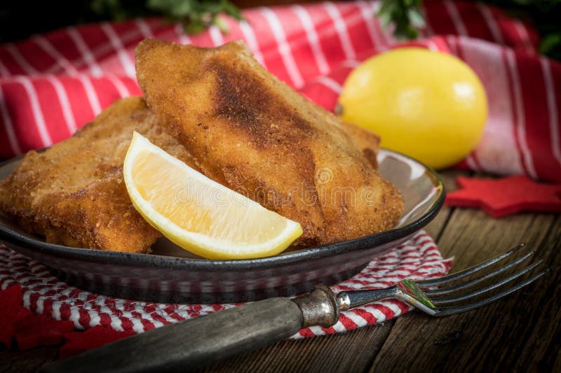 Fried cod slices in breadcrumbs stock photos