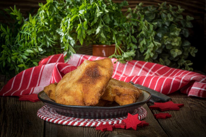 Fried cod slices in breadcrumbs stock images
