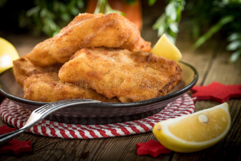 Fried cod slices in breadcrumbs royalty free stock photo