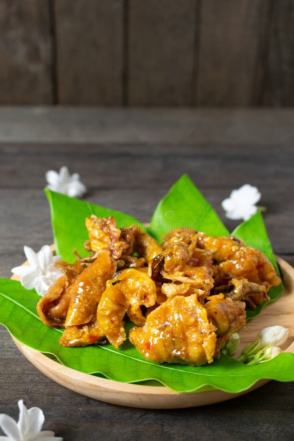 Fried Dried Squid on Mango Leaves in Wooden Dish Stock Photo Image of