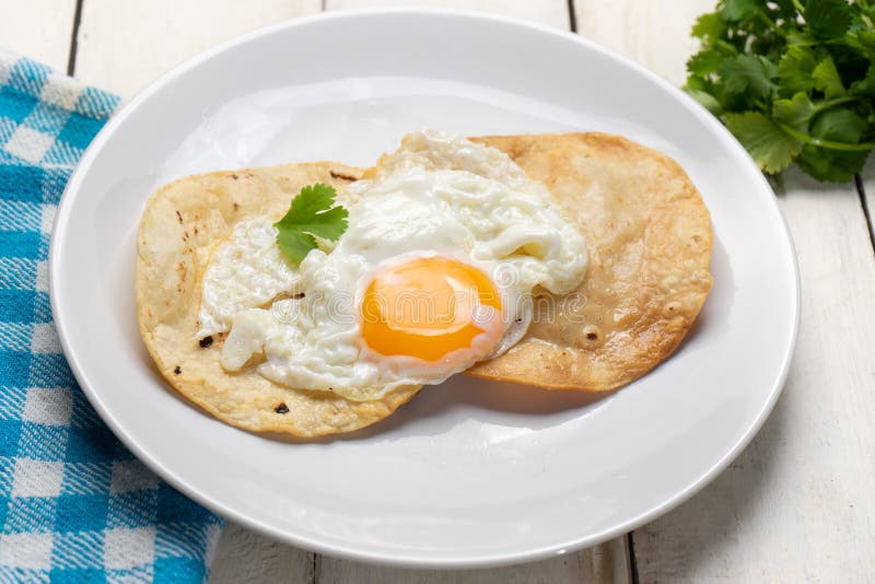 Fried Egg with Tortilla and Hot Sauce Stock Image - Image of fried