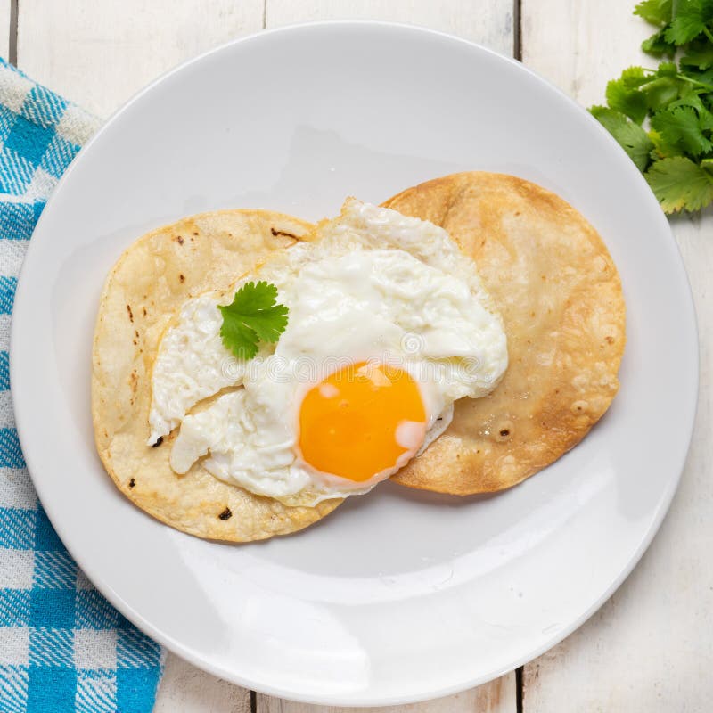 Fried Egg with Tortilla and Hot Sauce Stock Image - Image of fried