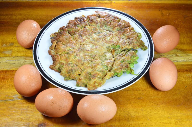 Fried egg crispy and fluffy on dish royalty free stock image