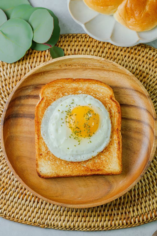 Fried Egg Crispy Toast Food with Pasley on Wood Plate Stock Image