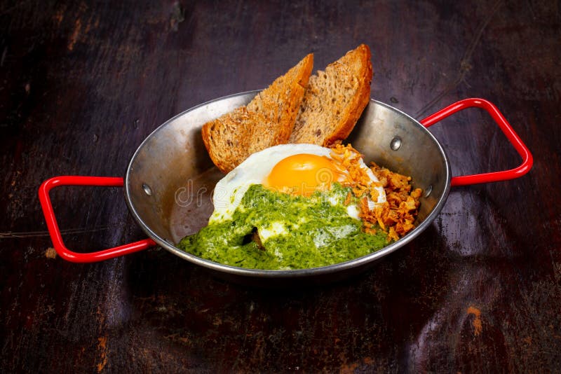 Fried egg with pesto stock image. Image of food, iron 122150985