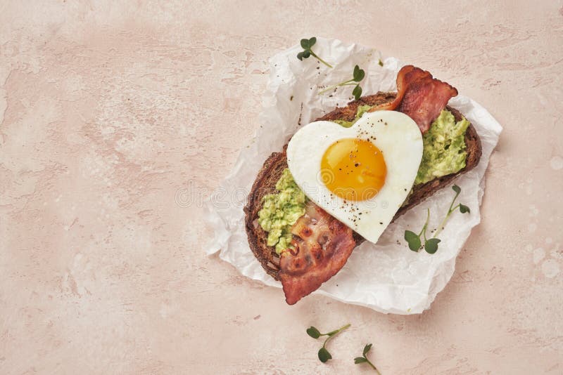 Fried Egg Sandwich with Avocado and Bacon Stock Photo - Image of toast