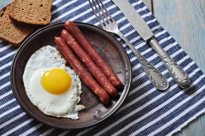 Fried egg with sausages stock photo. Image of pork, meal 35363352