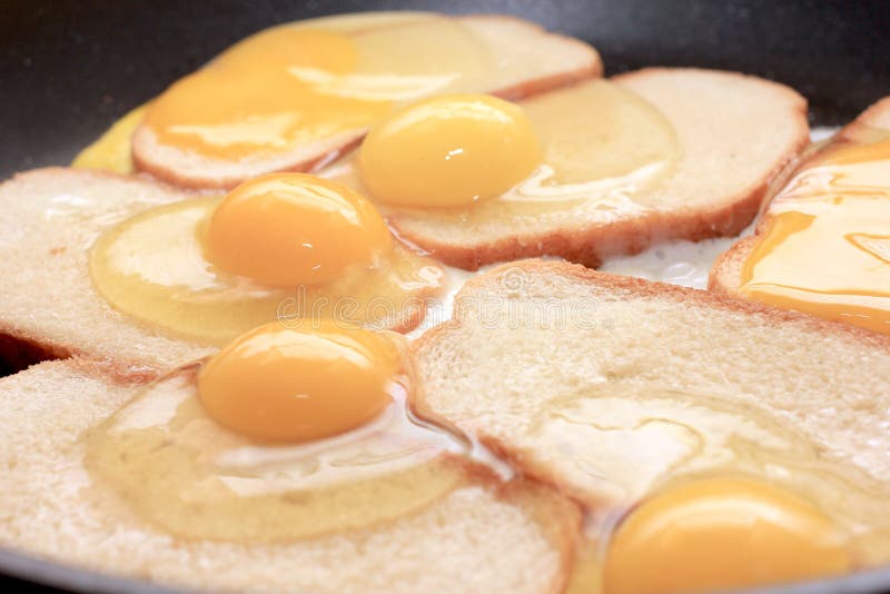 Fried eggs and fried bread stock photo. Image of macro 45189314