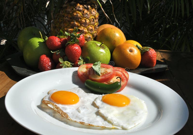 Fried eggs fruit exotic breakfast