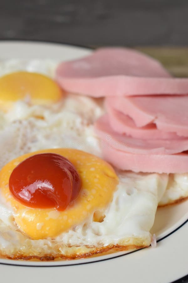 Fried Eggs with Ketchup and Ham Stock Photo Image of drops, drop 215739102